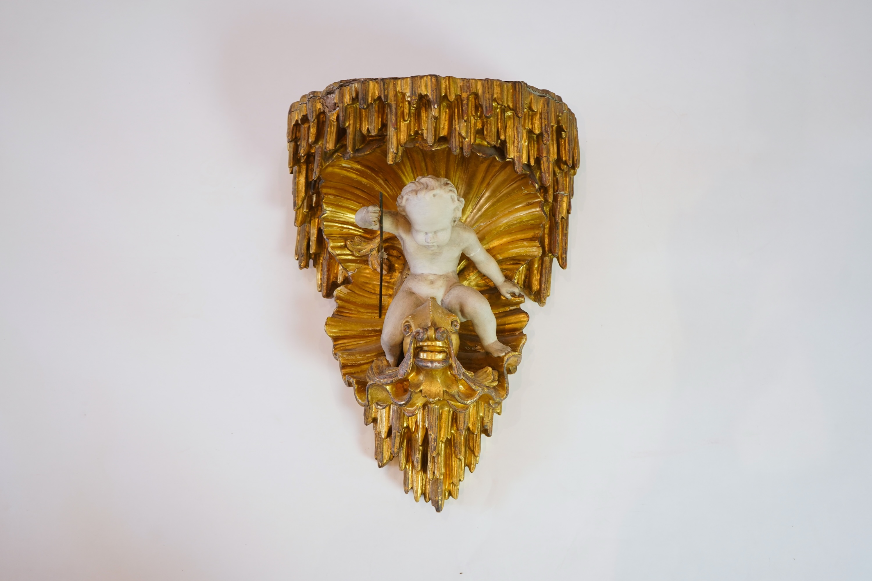 A late 18th / early 19th century carved and gilded wall bracket
